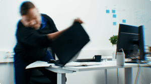 Team lead throwing the laptop into the ground in rage.